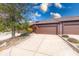 Townhouse exterior featuring a large driveway and attached one car garage at 802 Burwick Trce, Greenwood, IN 46143