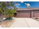Townhouse exterior featuring a large driveway and attached one car garage at 802 Burwick Trce, Greenwood, IN 46143