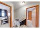 Hallway with staircase leading to bedrooms with windows and wood doors at 802 Burwick Trce, Greenwood, IN 46143