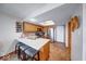 The kitchen is equipped with a breakfast bar, stainless steel appliances, and a skylight for natural lighting at 802 Burwick Trce, Greenwood, IN 46143