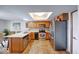 A well-lit kitchen features a peninsula, stainless steel appliances, and plenty of cabinet storage space at 802 Burwick Trce, Greenwood, IN 46143