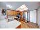 Bright kitchen with stainless steel appliances, tiled backsplash, skylight and ample counter space for food preparation at 802 Burwick Trce, Greenwood, IN 46143