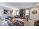 Cozy living room with stone fireplace and plush seating at 802 Burwick Trce, Greenwood, IN 46143