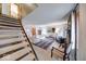 Open-concept living room with staircase and comfortable furnishings at 802 Burwick Trce, Greenwood, IN 46143