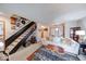 Open living room with plush sofa and staircase at 802 Burwick Trce, Greenwood, IN 46143
