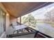 Enclosed patio with seating area and scenic water view at 802 Burwick Trce, Greenwood, IN 46143