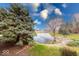 Scenic backyard pond with lush landscaping and mature trees at 802 Burwick Trce, Greenwood, IN 46143