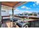 Comfortable balcony area perfect for relaxing, complete with a table and chairs and lovely outdoor views at 934 E Minnesota St, Indianapolis, IN 46203