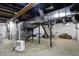Unfinished basement with exposed ductwork and utilities, offering potential for customization at 934 E Minnesota St, Indianapolis, IN 46203
