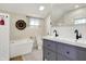 Modern bathroom with double vanity, stylish fixtures, and a soaking tub at 934 E Minnesota St, Indianapolis, IN 46203
