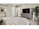 Stylish bedroom with a large bed, modern furniture, and an open view to the bathroom at 934 E Minnesota St, Indianapolis, IN 46203
