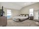 Spacious bedroom with neutral decor, two windows, and a comfortable bed at 934 E Minnesota St, Indianapolis, IN 46203