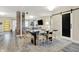 Spacious dining room featuring a modern table, chairs, and barn door accent at 934 E Minnesota St, Indianapolis, IN 46203