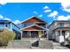 Charming two-story home featuring a welcoming front porch, updated siding, and well-maintained landscaping at 934 E Minnesota St, Indianapolis, IN 46203