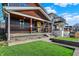 Beautifully landscaped front yard featuring a well-manicured lawn and a covered front porch, providing curb appeal at 934 E Minnesota St, Indianapolis, IN 46203