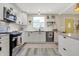Modern kitchen featuring white cabinets, stainless steel appliances, and a bright window at 934 E Minnesota St, Indianapolis, IN 46203