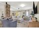 Comfortable living room with neutral tones, exposed brick, plush seating, and lots of natural light at 934 E Minnesota St, Indianapolis, IN 46203