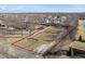 Beautiful aerial view of land lot featuring mature trees and surrounding neighborhood at 10990 Brooks School Rd, Fishers, IN 46037