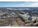 Beautiful aerial view of land lot featuring frozen pond, mature trees and surrounding neighborhood at 10990 Brooks School Rd, Fishers, IN 46037