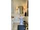 Charming powder room with pedestal sink and decorative sconces at 12652 Meeting House Rd, Carmel, IN 46032