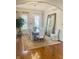 Inviting dining room features hardwood floors, a chandelier, and an oversized mirror at 12652 Meeting House Rd, Carmel, IN 46032