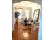 Inviting dining room features hardwood floors, a chandelier, and an oversized mirror at 12652 Meeting House Rd, Carmel, IN 46032