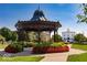 Picture of a park grounds with a decorative gazebo and a historical building at 12652 Meeting House Rd, Carmel, IN 46032