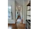 Hallway with hardwood floors, decorative rug, and natural light at 12652 Meeting House Rd, Carmel, IN 46032