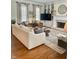 Cozy living room with fireplace, built-ins, and hardwood floors at 12652 Meeting House Rd, Carmel, IN 46032