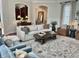 Bright living room with elegant furniture, neutral colors, and natural light at 12652 Meeting House Rd, Carmel, IN 46032