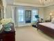 Bright main bedroom with tray ceiling and two large windows at 12652 Meeting House Rd, Carmel, IN 46032