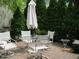 Outdoor patio with comfortable seating under a large umbrella at 12652 Meeting House Rd, Carmel, IN 46032