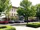 Charming street view with vibrant green trees and well-maintained buildings at 12652 Meeting House Rd, Carmel, IN 46032