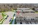 Aerial view of modern townhomes with private balconies surrounded by green spaces at 13783 Tender Dr, Carmel, IN 46032