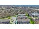 Drone shot showing residential community with modern townhomes near wooded area at 13783 Tender Dr, Carmel, IN 46032