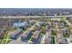 Expansive view of townhomes near a tranquil pond, trees, and highway at 13783 Tender Dr, Carmel, IN 46032