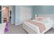 Bedroom featuring white trim, a bed with pink accents, and a purple chair at 13783 Tender Dr, Carmel, IN 46032