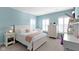 Bedroom featuring a bed with pink accents, and matching dressers with lamps and decorations at 13783 Tender Dr, Carmel, IN 46032