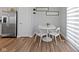 Breakfast nook featuring a white table with seating for four with stainless fridge at 13783 Tender Dr, Carmel, IN 46032