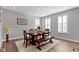 Bright dining room featuring a wood table set with seating for six and lots of natural light at 13783 Tender Dr, Carmel, IN 46032