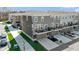 Stunning townhome exteriors boast private balconies, attached garages, and manicured landscaping at 13783 Tender Dr, Carmel, IN 46032