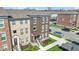 New construction townhome featuring a brick facade, manicured landscaping, and convenient parking at 13783 Tender Dr, Carmel, IN 46032