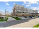 Charming townhomes with attached garages, balconies, and manicured lawns under a bright sky at 13783 Tender Dr, Carmel, IN 46032