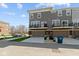 Exterior shot of grey townhome with garage and balcony at 13783 Tender Dr, Carmel, IN 46032