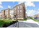 Lovely new construction townhome with brick elevation, sidewalk, and manicured lawn at 13783 Tender Dr, Carmel, IN 46032