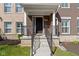 Inviting front porch with a classic design, featuring a brick facade and decorative railings at 13783 Tender Dr, Carmel, IN 46032