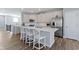 Kitchen with a large center island featuring white cabinets and bar stool seating at 13783 Tender Dr, Carmel, IN 46032
