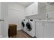 Laundry room featuring washer, dryer, and cabinets at 13783 Tender Dr, Carmel, IN 46032