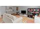 Comfortable living room featuring modern decor, a shelving unit and entertainment center at 13783 Tender Dr, Carmel, IN 46032