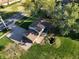 Aerial view of a single Gathering home with a patio and a spacious driveway, with an manicured lawn at 1402 Hornaday Rd, Brownsburg, IN 46112